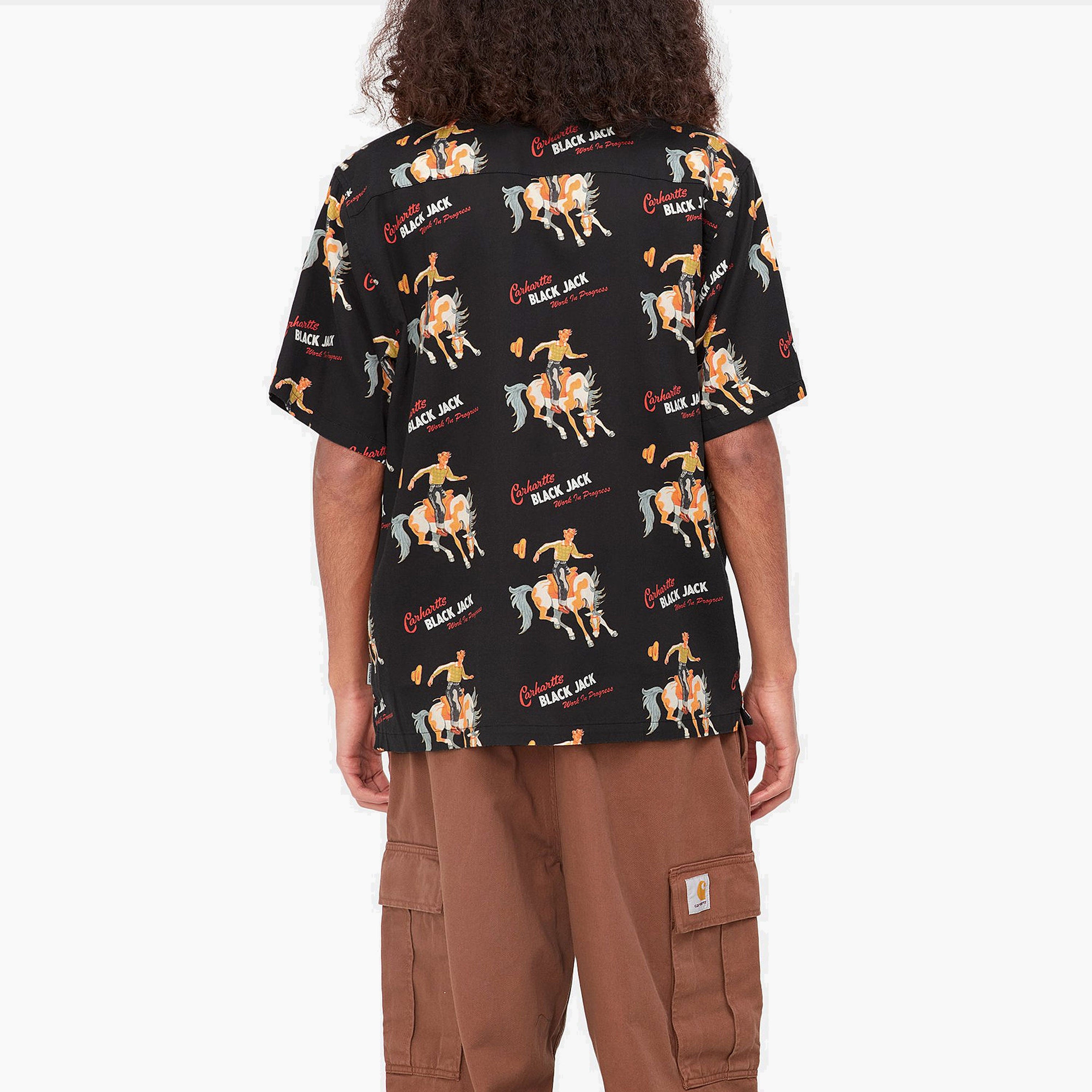 Camisa Carhartt Manga Corta | Camisa de manga corta para hombre fabricado en combinación de algodón y tencel. Presenta un diseño de estampados gráficos alrededor de la prenda. Corte Holgado. Bolsillo frontal. Cierre abotonado.