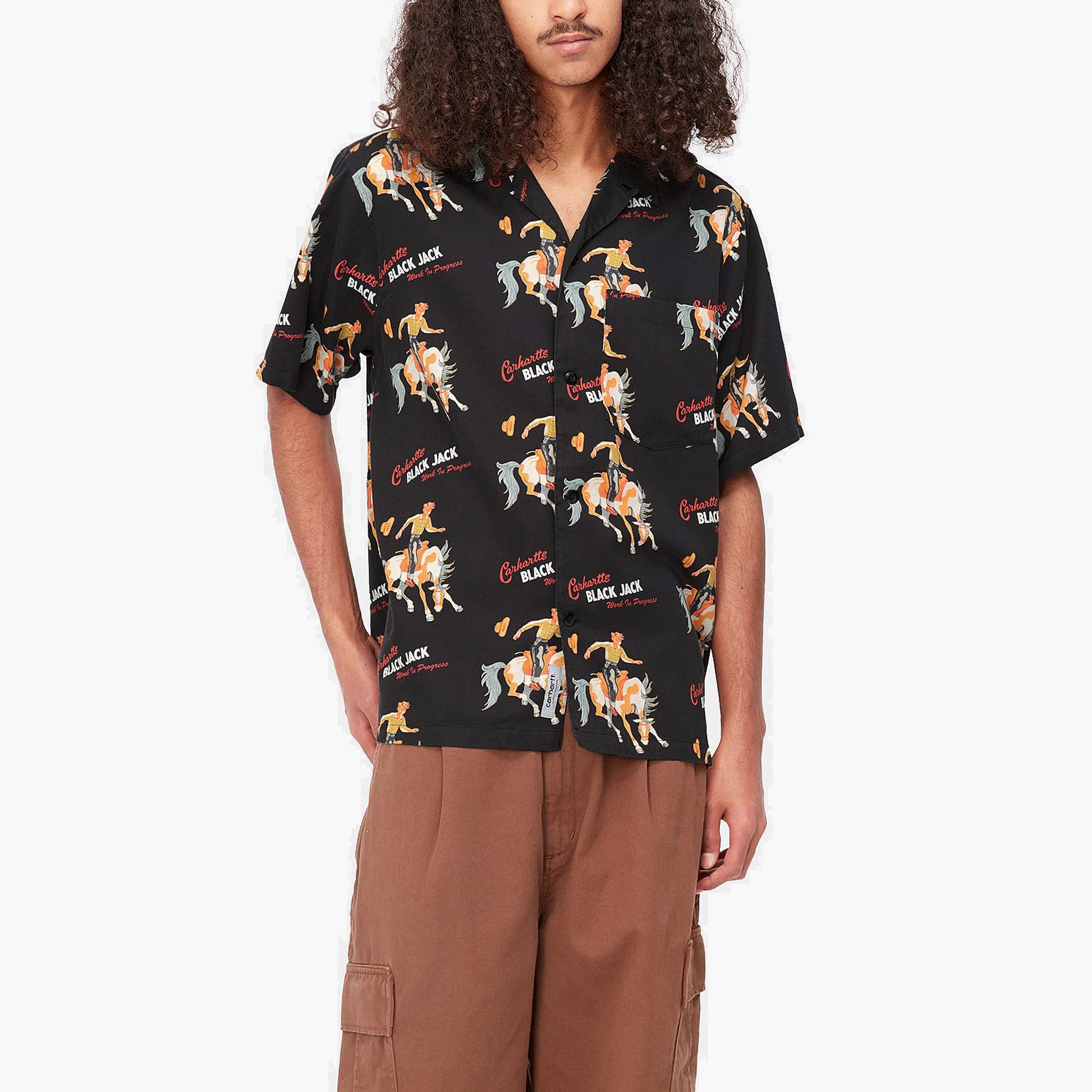 Camisa Carhartt Manga Corta | Camisa de manga corta para hombre fabricado en combinación de algodón y tencel. Presenta un diseño de estampados gráficos alrededor de la prenda. Corte Holgado. Bolsillo frontal. Cierre abotonado.