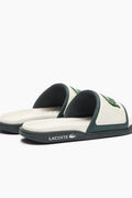 Chanclas Lacoste | Chanclas Lacoste Hombre | Las Serve Slide cuentan con una suela de doble densidad fabricada a partir de una plantilla blanda para garantizar la comodidad bajo los pies, mientras que la tira moldeada está recubierta de espuma. Forro fabricado con una suave malla y diseño se completa con el emblemático cocodrilo.