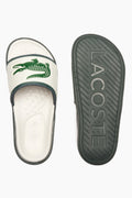 Chanclas Lacoste | Chanclas Lacoste Hombre | Las Serve Slide cuentan con una suela de doble densidad fabricada a partir de una plantilla blanda para garantizar la comodidad bajo los pies, mientras que la tira moldeada está recubierta de espuma. Forro fabricado con una suave malla y diseño se completa con el emblemático cocodrilo.