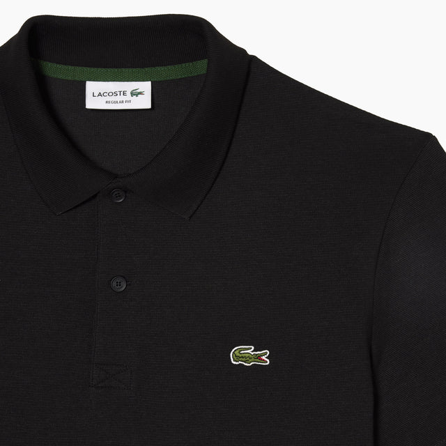 Polo Lacoste | Apuesta por un look impecable con este emblemático polo. Promete una sensación de ligereza dondequiera que vayas. Estilo y comodidad en todo momento. Corte Regular.